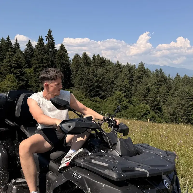 Rider on a CF MOTO quad in a meadow near Liptovsky Jan